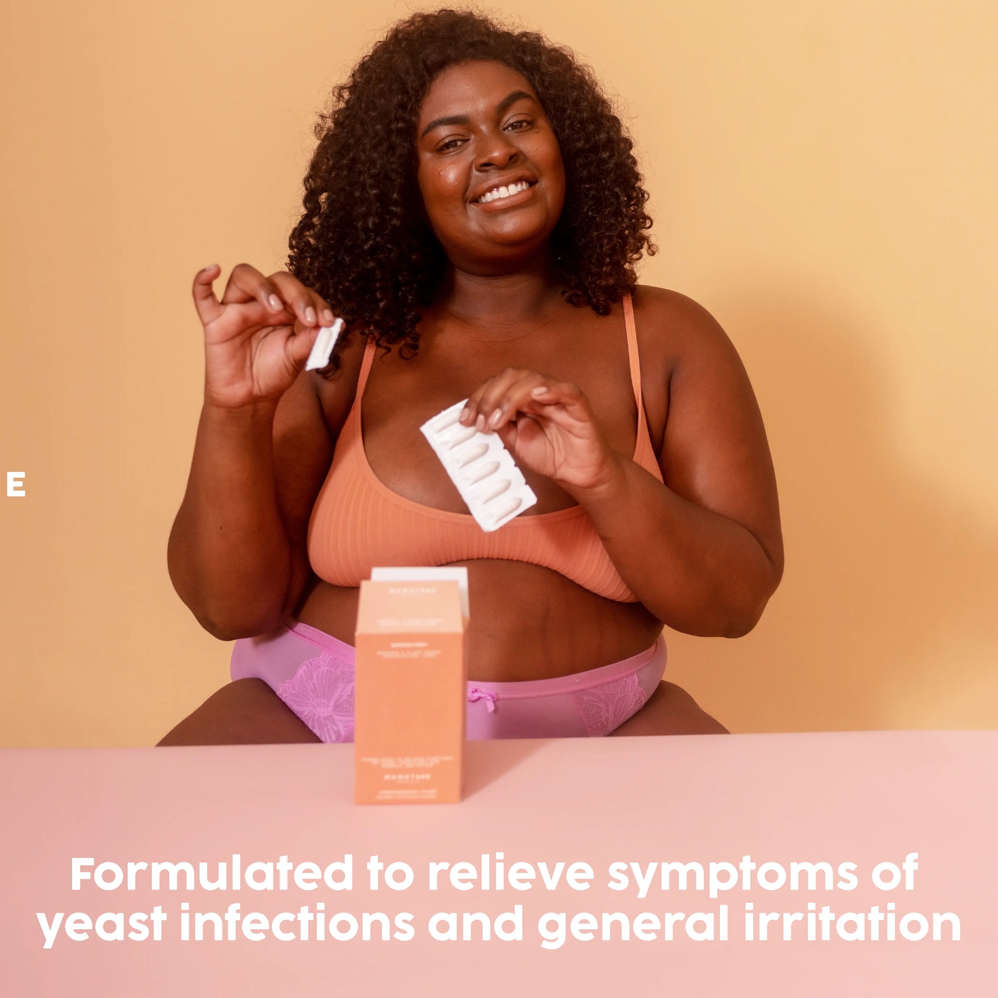 Formulated to relieve symptoms, Black girl holding a suppository pack in hand.